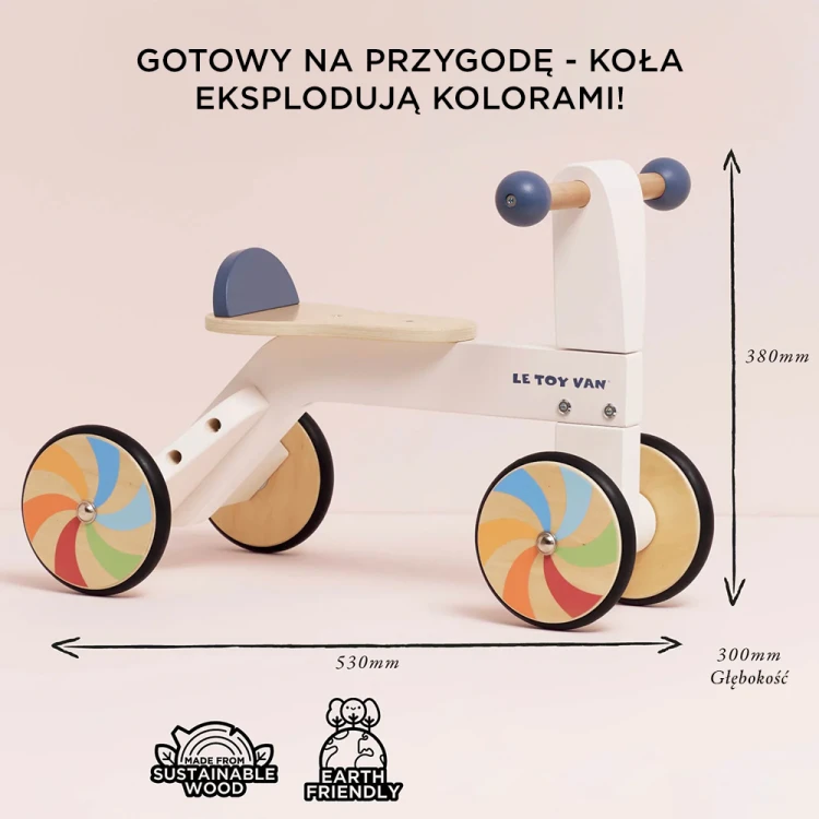 Drewniany jeździk Le Toy Van z tęczowymi kołami dla dzieci od 18 miesiąca życia